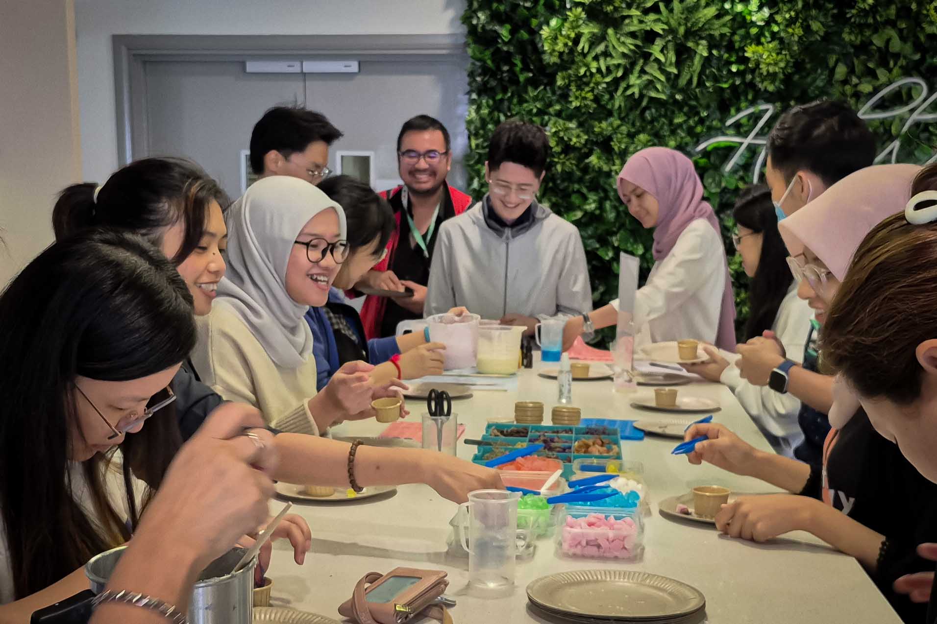 Participants enjoying a hands-on soap-making workshop at Emspaced KL Sentral.